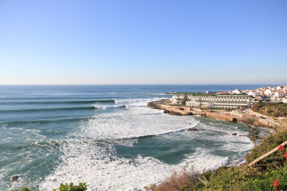 Waves breaking in front of the Vila Galé hotel in Ericeira at the surf spot Furnas