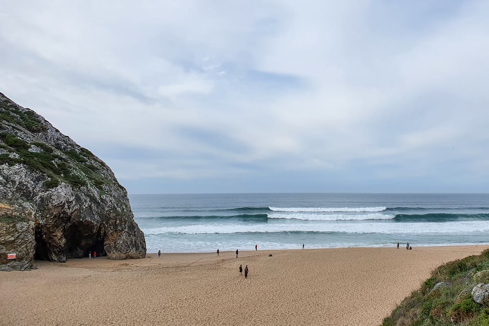 Waves breaking both left and right at Praia da Adraga